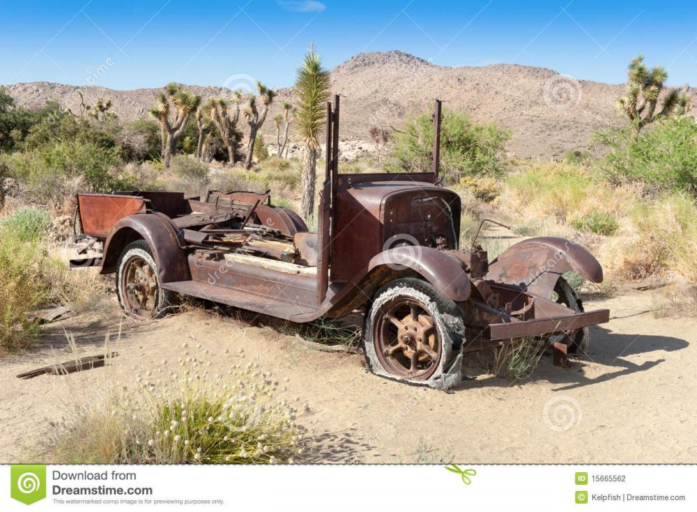 abandoned-car-desert-15665562.jpg