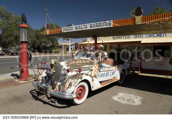 old-gas-pump-and-decorated-vintage-car-parked-in-front-of-burger-joint-in-seligman-arizona-off-route-66.jpg